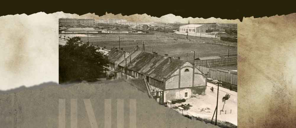 Stare zdjęcie z dzielnicy Grabówek przestawia szereg budynków jednorodzinnych stojących obok pola 