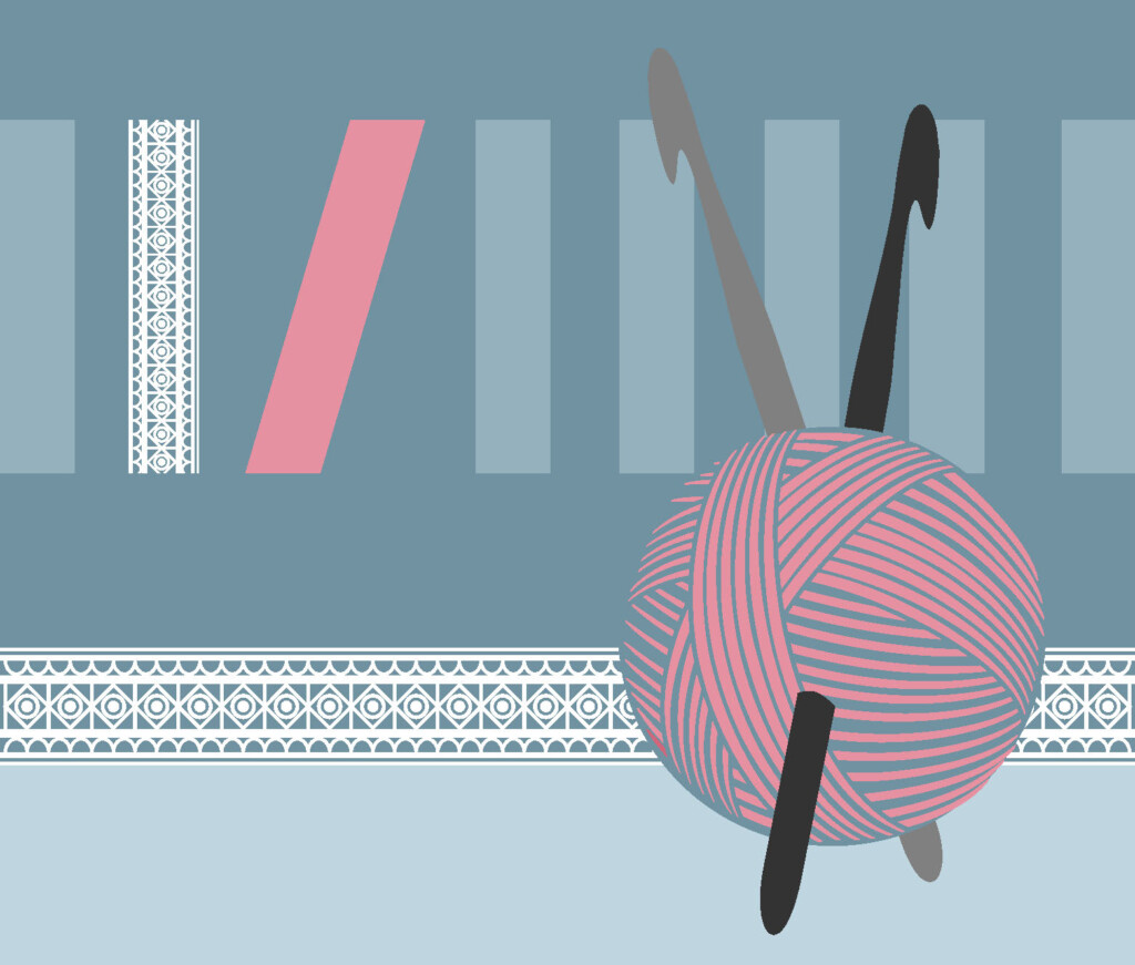 Różowy motek z wbitymi szydełkami na niebieskim tle