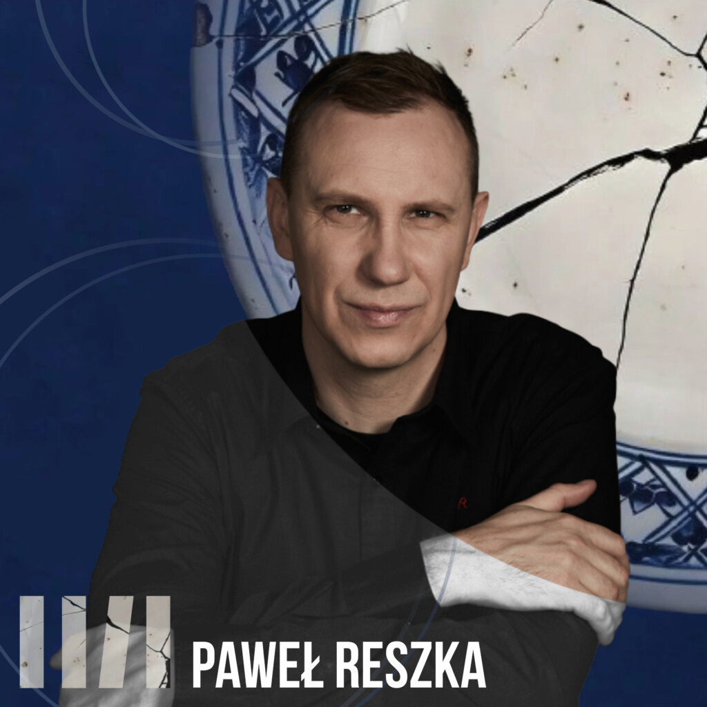 Paweł Reszka - mężczyzna ubrany na czarno z krótkimi ciemnymi włosami